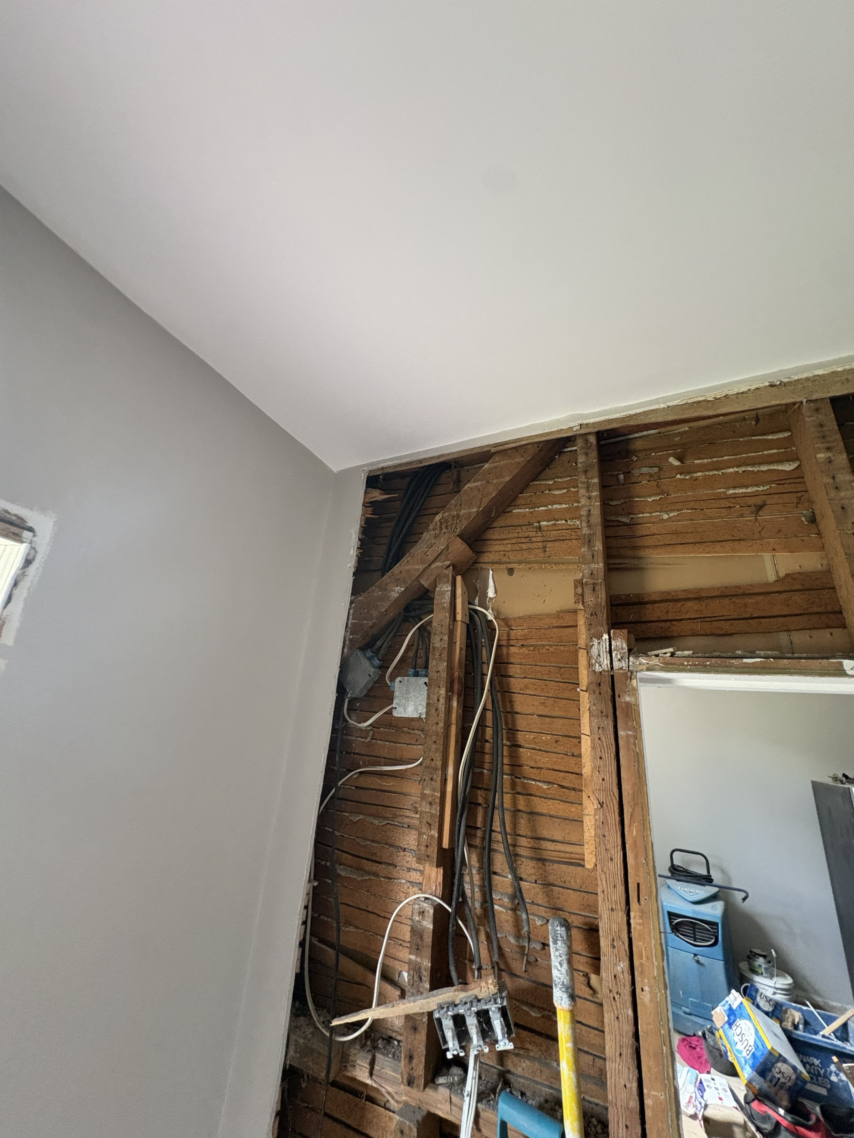 Open wall cavity in a Smiths Falls home showing existing wiring and electrical boxes exposed during pre-rewire assessment
